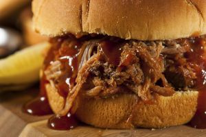 Barbeque Pulled Pork Sandwich with BBQ Sauce and Fries