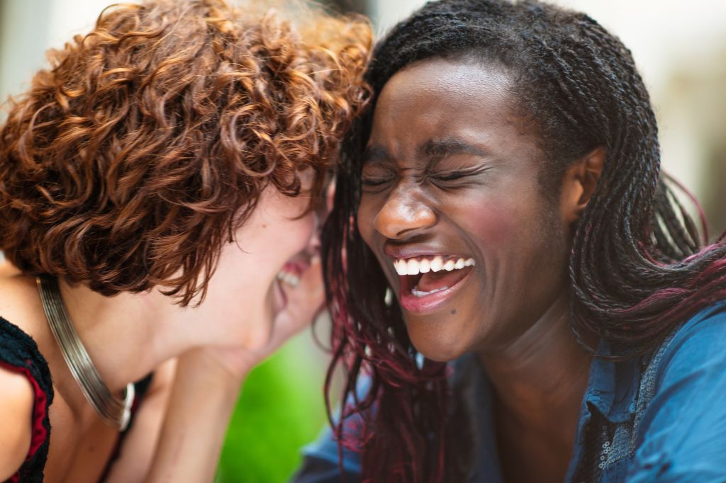 Laughing mixed race girlfriends