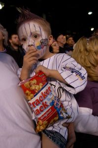 10.28.2007 -- CRACKER JACK: Cooper Hertz, 3, of Breckridge, digs in to a package of Cracker Jacks prior to the start of game four of the World Series between the Colorado Rockies and Boston Red Sox at Coors Field in Denver Saturday night, Oct. 28, 2007. T