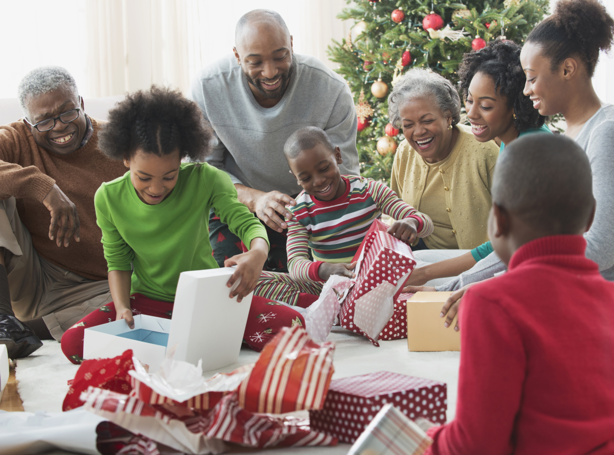 Family opening Christmas presents together