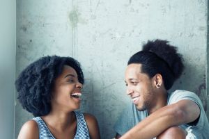 Portrait of young African American couple laughing