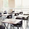 Tests on desks in empty classroom