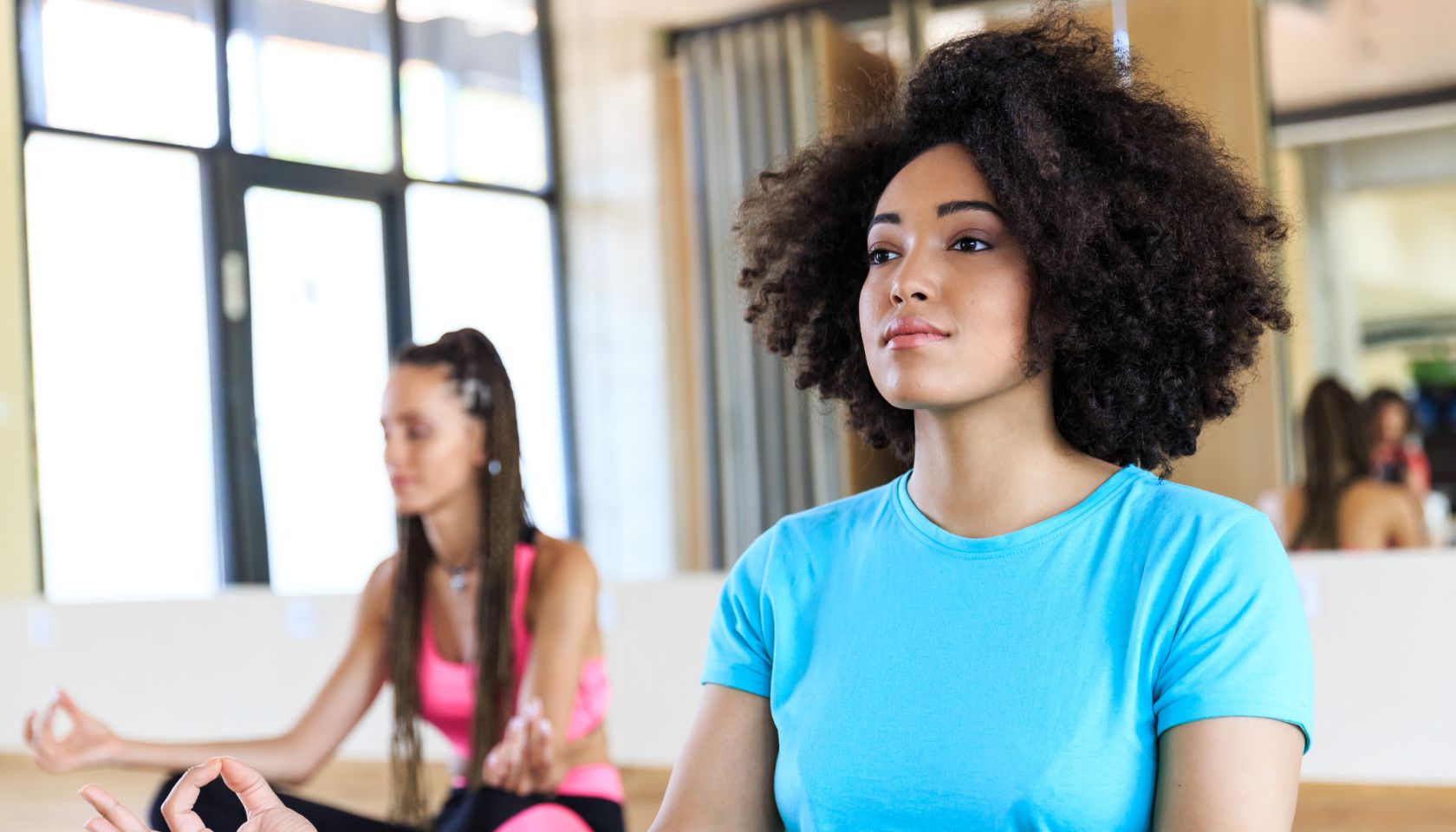 Woman practicing yoga in gym
