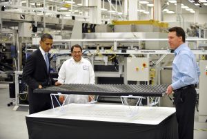 US President Barack Obama lifts a solar