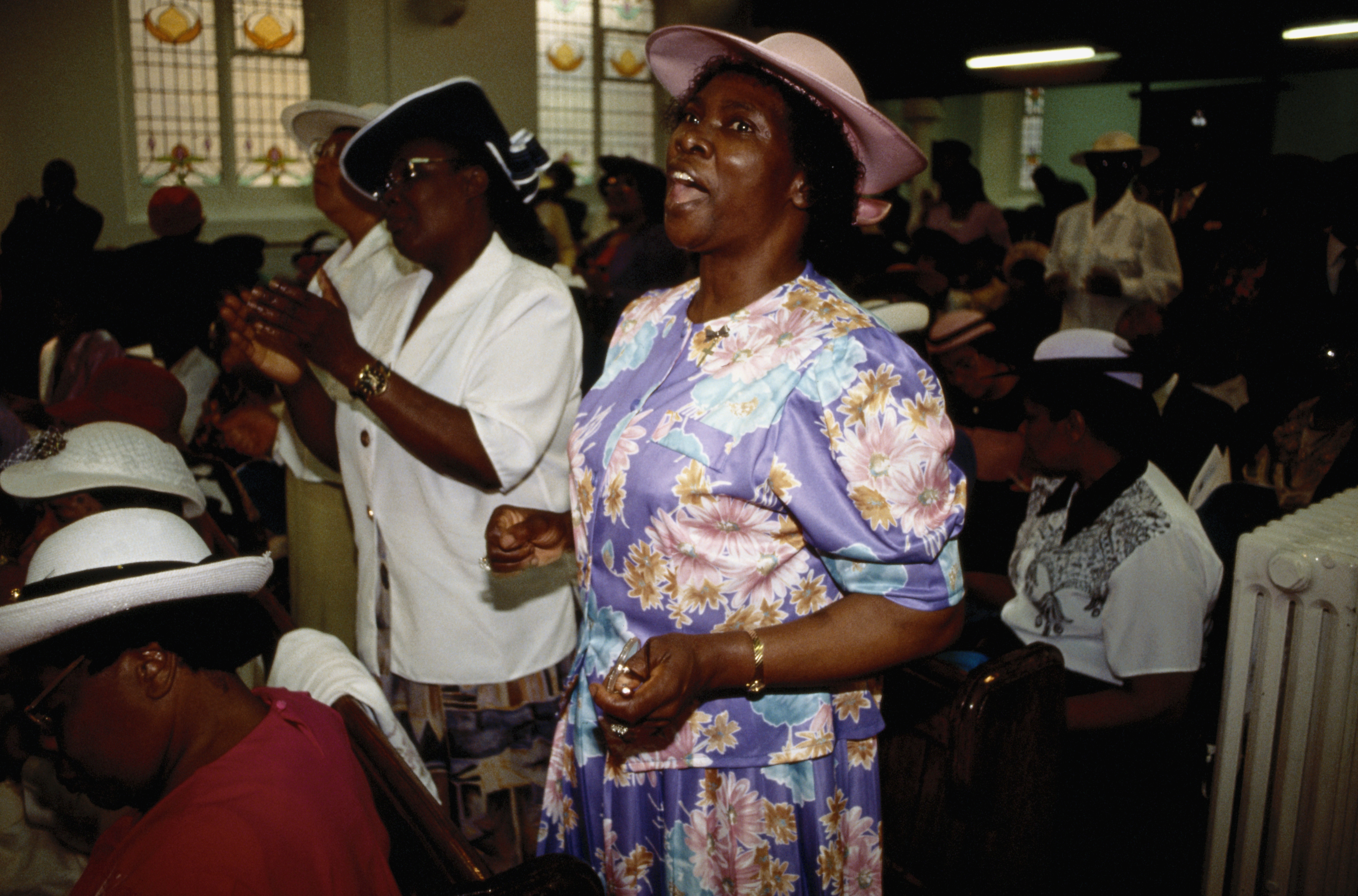Women Singing During Church Service