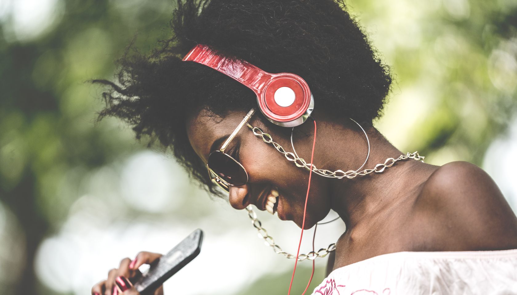 Woman Listening Music at Park