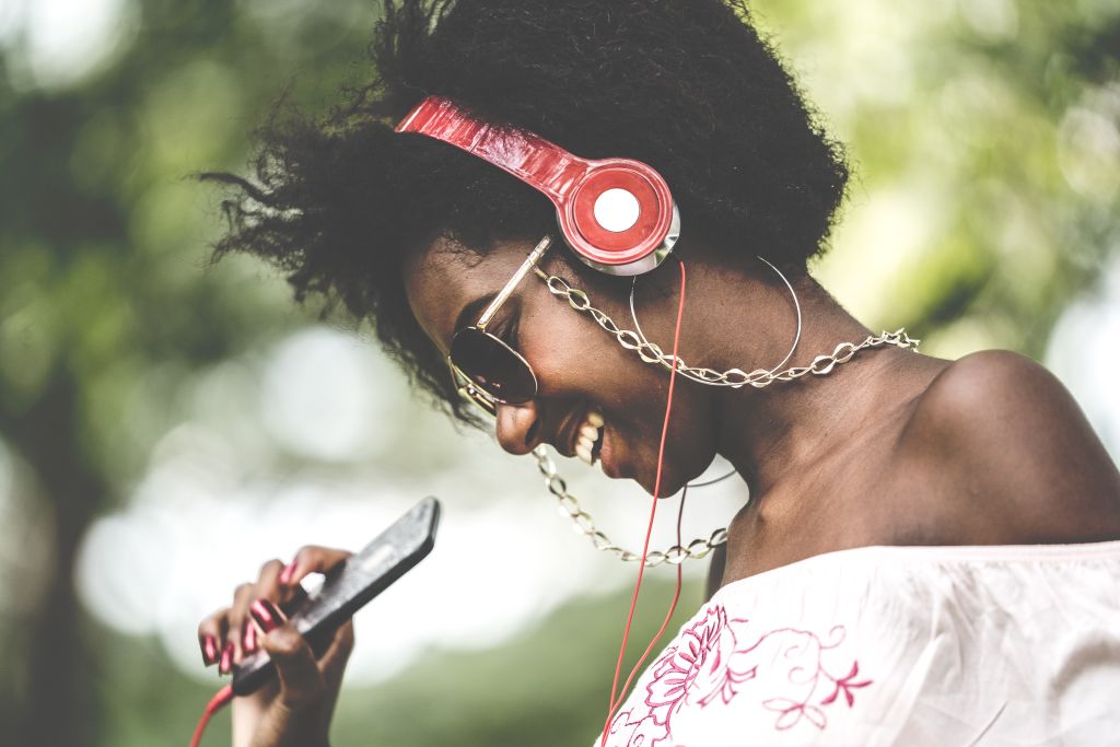 Woman Listening Music at Park