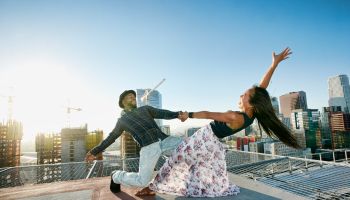 Couple dancing on urban rooftop