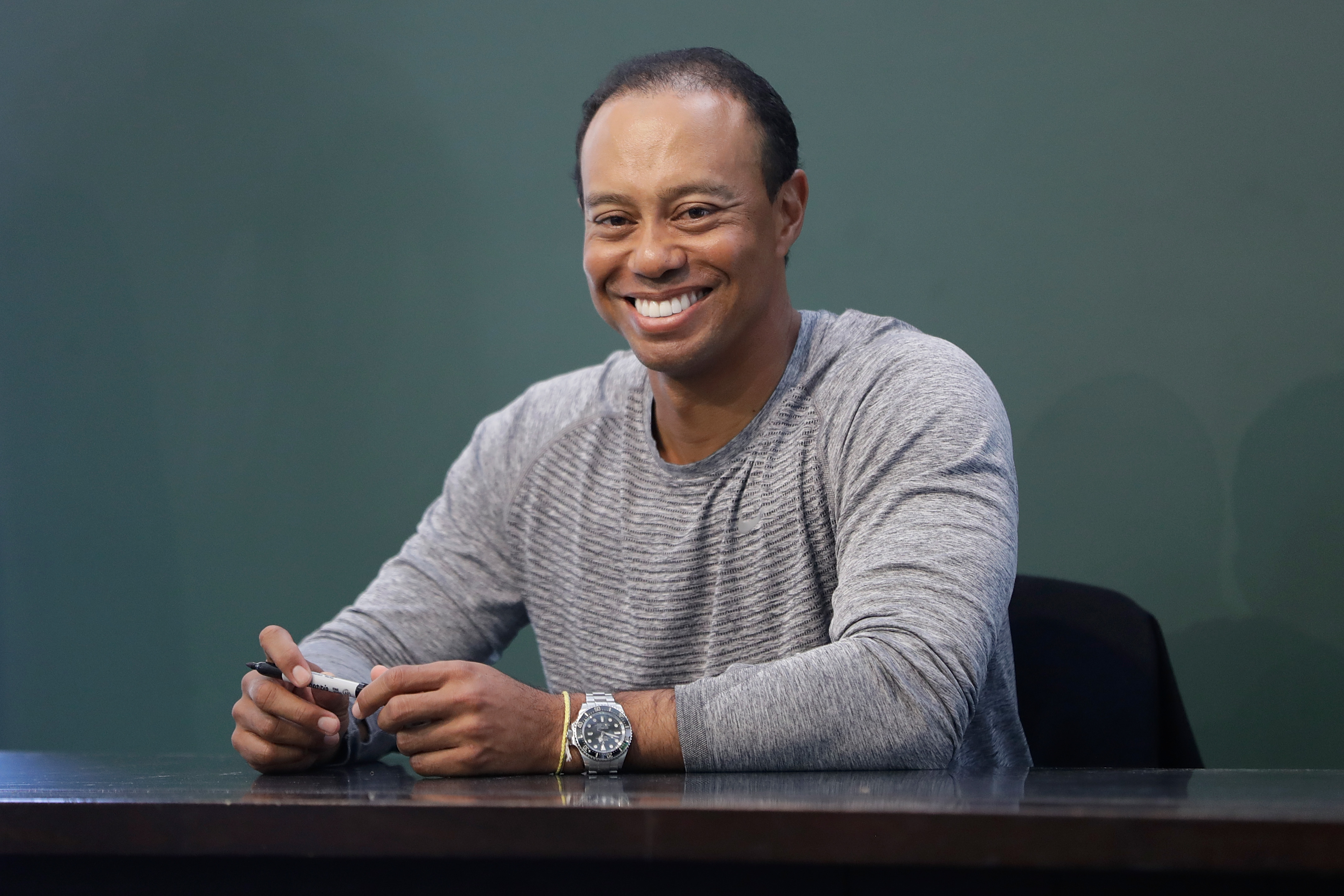 Tiger Woods Signs Copies Of His New Book 'The 1997 Masters: My Story'