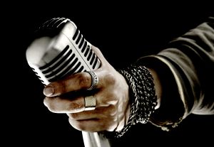 Man holding microphone, close-up