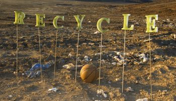 The word 'Recycle' at a city dump.