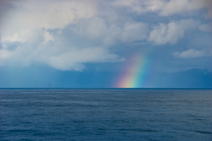 Rainbow over the ocean horizon