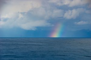 Rainbow over the ocean horizon