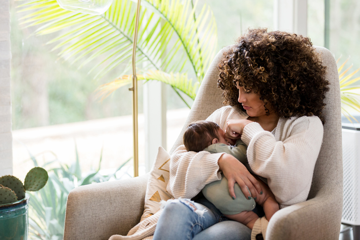 Mom nurses newborn son