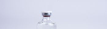 Bottle with vaccine against covid-19 and syringe on white background for background usage Vial with,Oradea,Romania