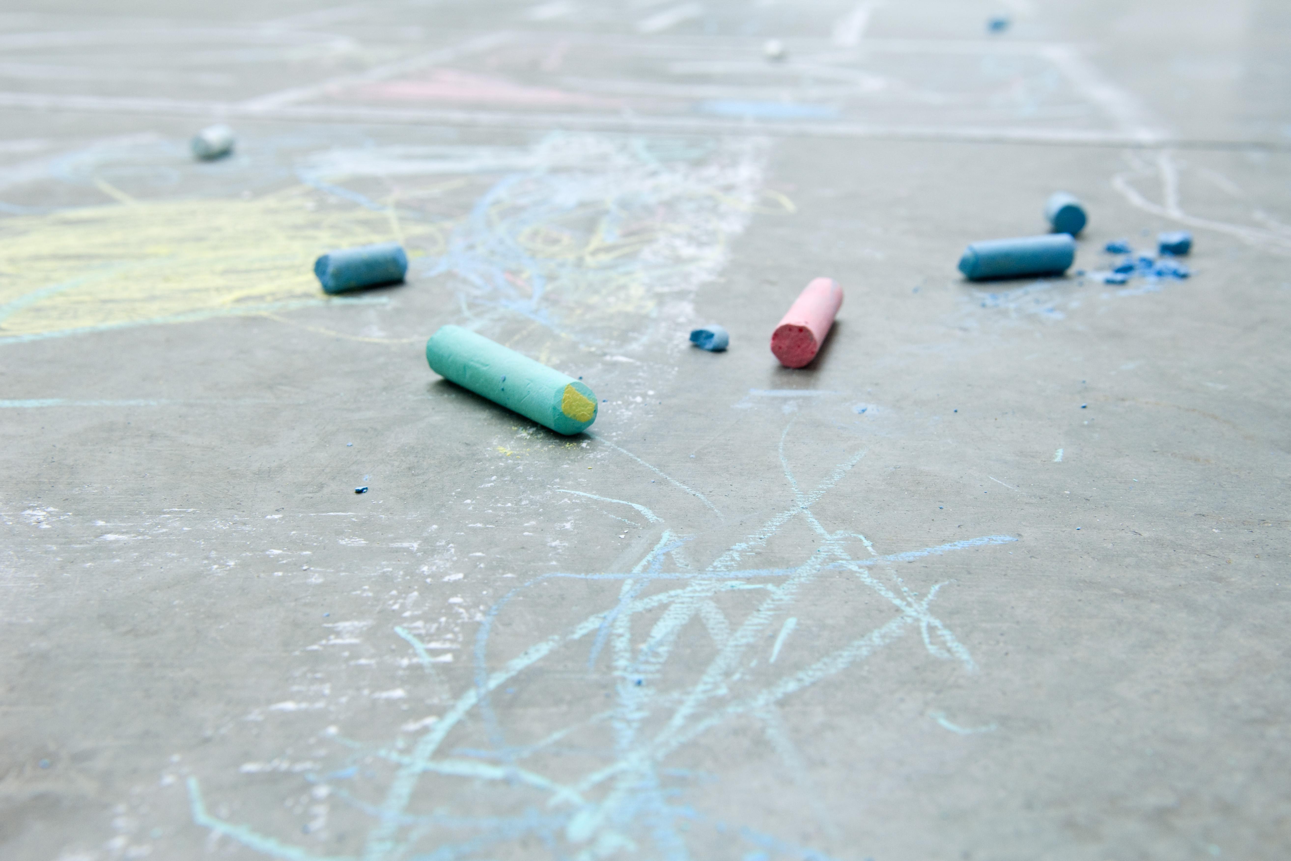 Chalk and drawings on the ground, close-up