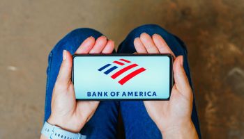 In this photo illustration, the Bank of America logo is...