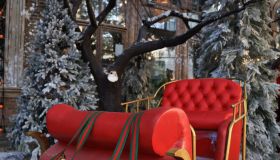 Red seat on deer wagon decoration for Merry Christmas and Happy New Year celebration concept