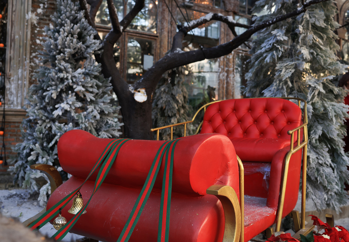 Red seat on deer wagon decoration for Merry Christmas and Happy New Year celebration concept