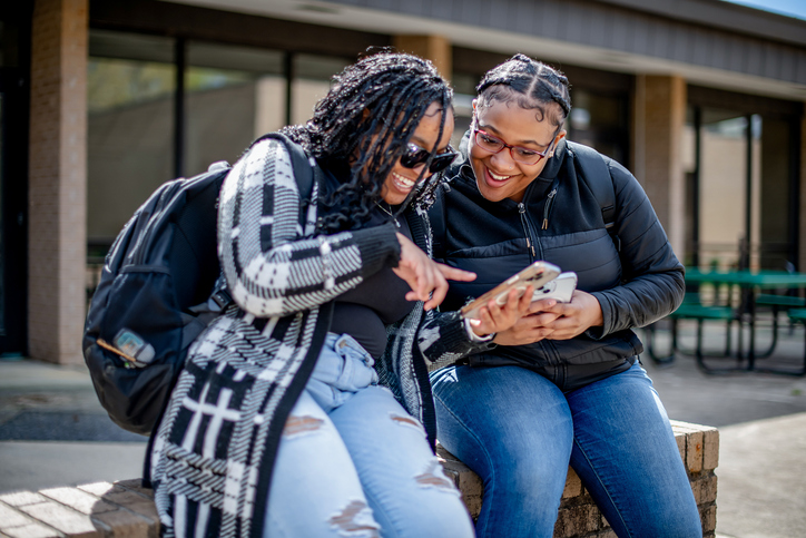 Friends on campus in-between classes