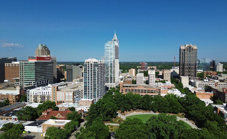 View of the downtown Raleigh skyline with Moore Square park in the lower right