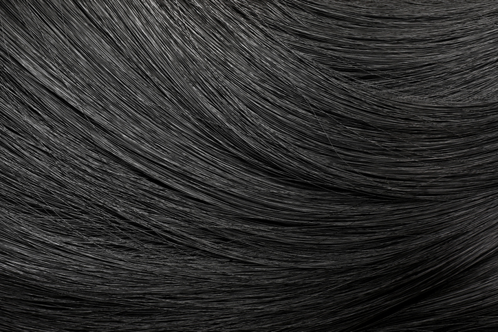 Beautiful shiny black hair as background, top view